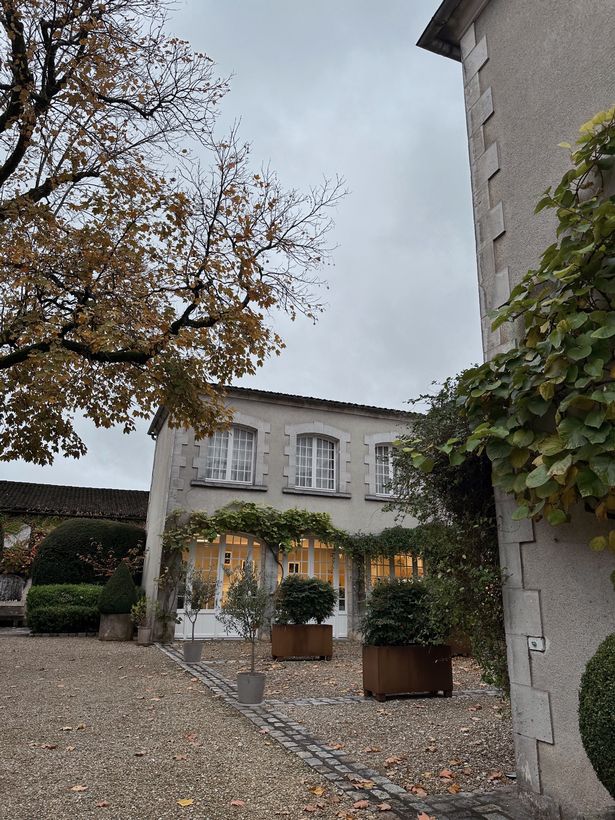 A house in France with a big courtyard.