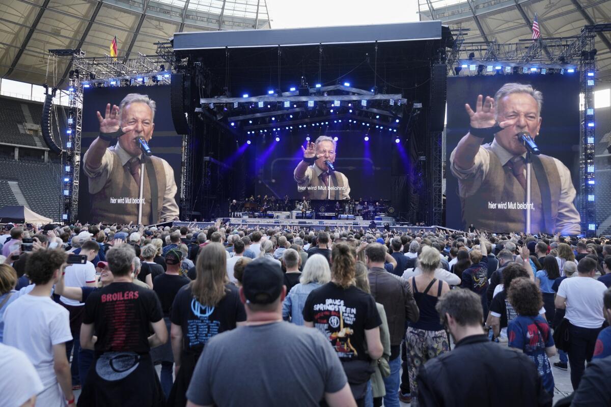 Springsteen addresses a massive stadium crowd in Germany.