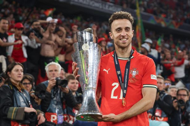 MUNICH, GERMANY - JUNE 08: Diogo Jota of Portugal poses for a photograph with the UEFA Nations League trophy after his team's victory in the UEFA Nations League 2025 final match between Portugal and Spain at Munich Football Arena on June 08, 2025 in Munich, Germany. (Photo by Maja Hitij - UEFA/UEFA via Getty Images)