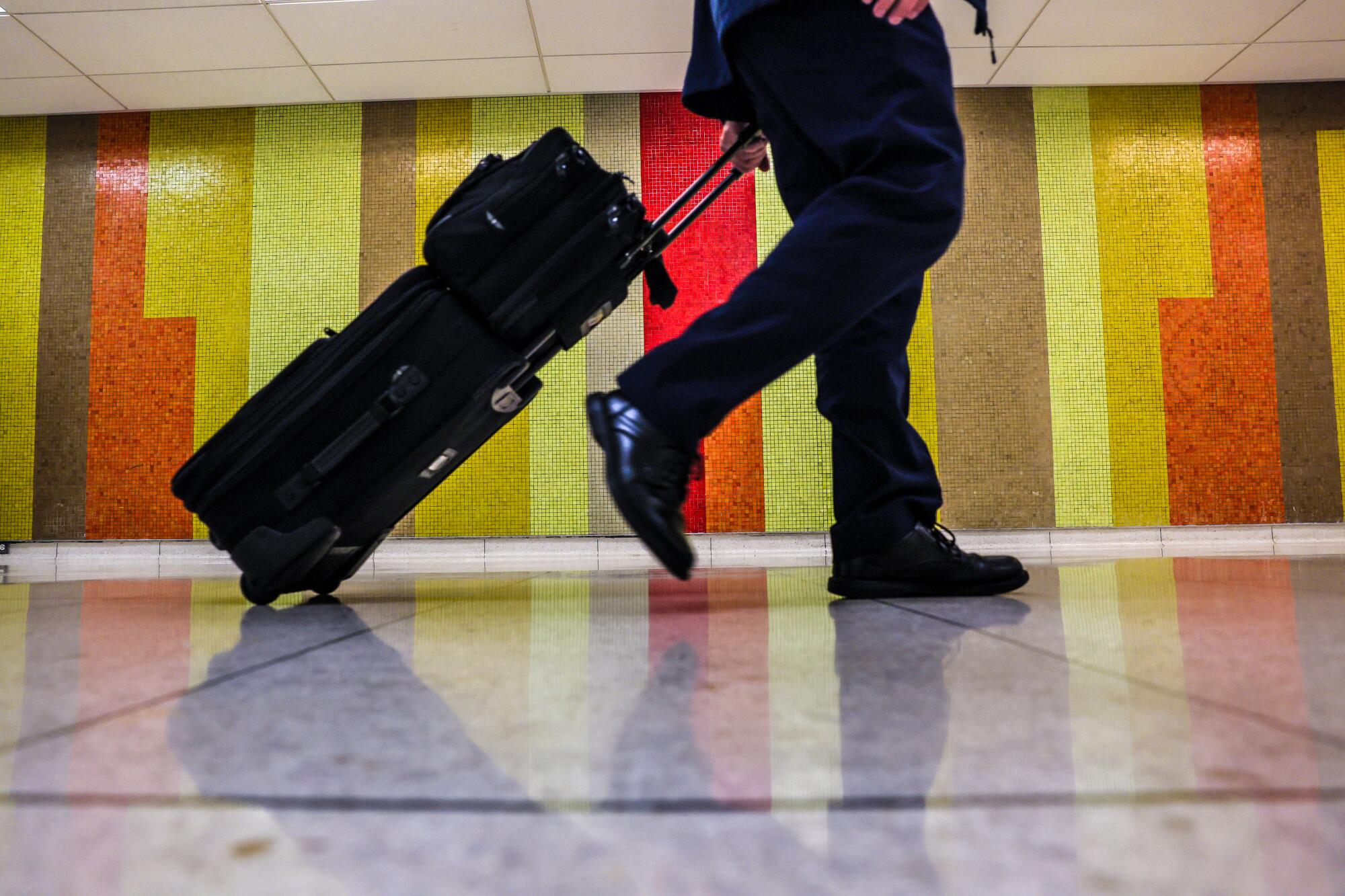 Tile mosaic wall designs line departure halls in various LAX terminals.