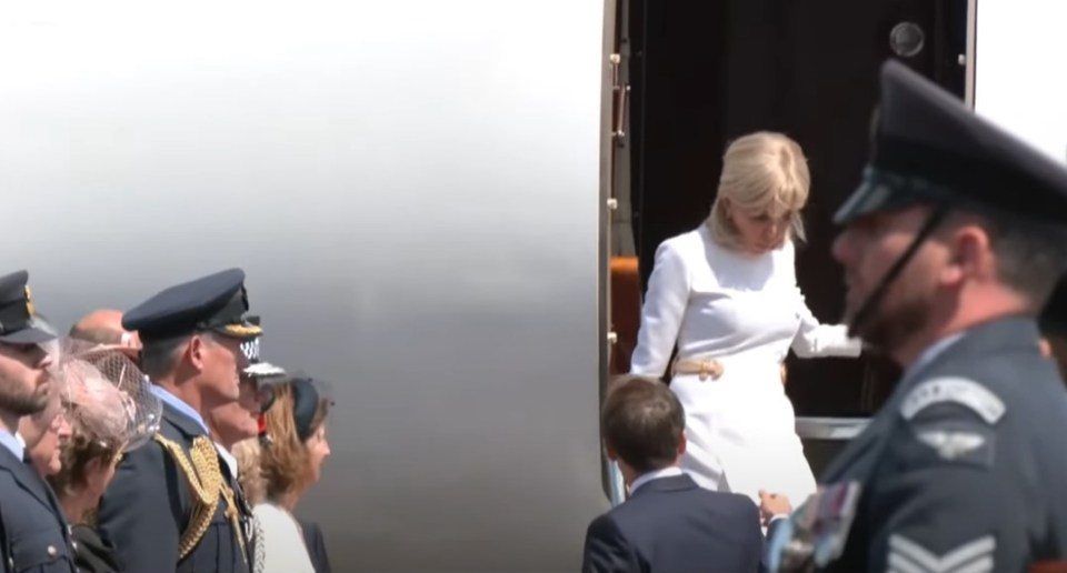 Brigitte Macron exiting a plane.