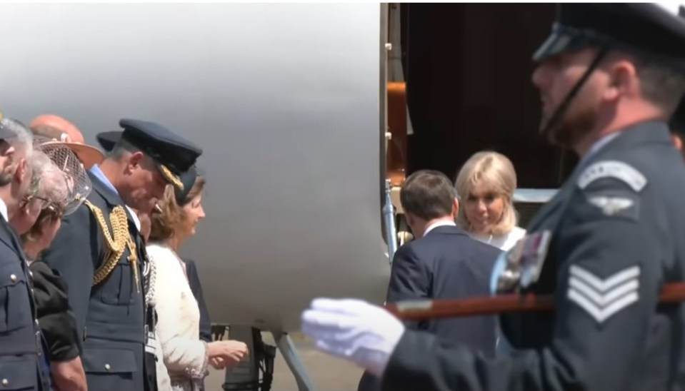 Brigitte Macron and Emmanuel Macron exiting a plane.