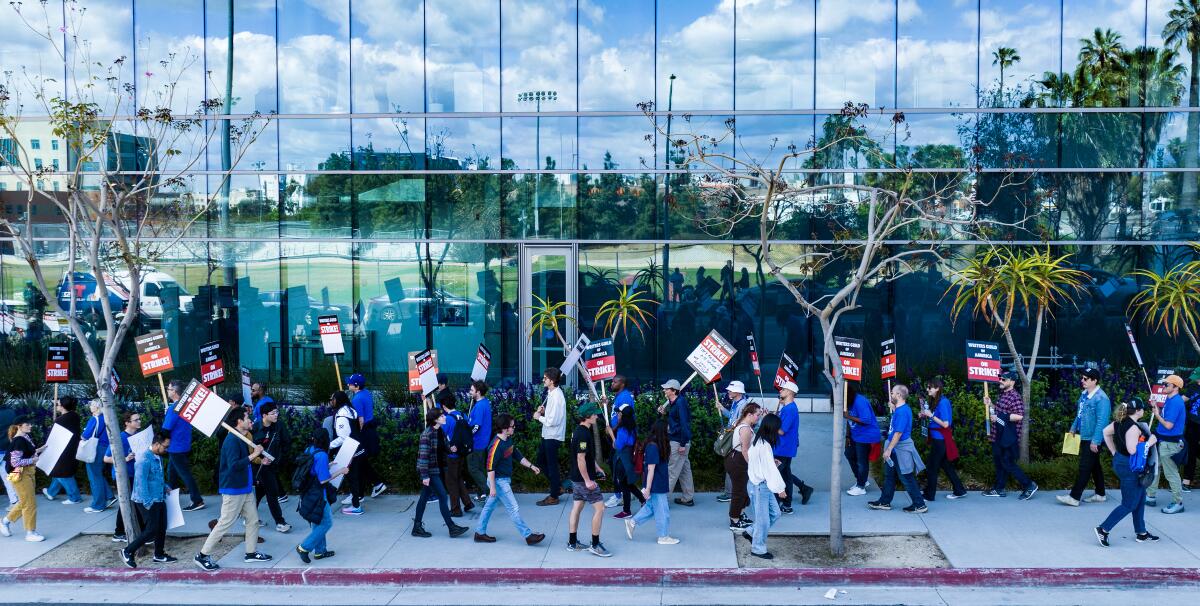 strikers walk a picket line