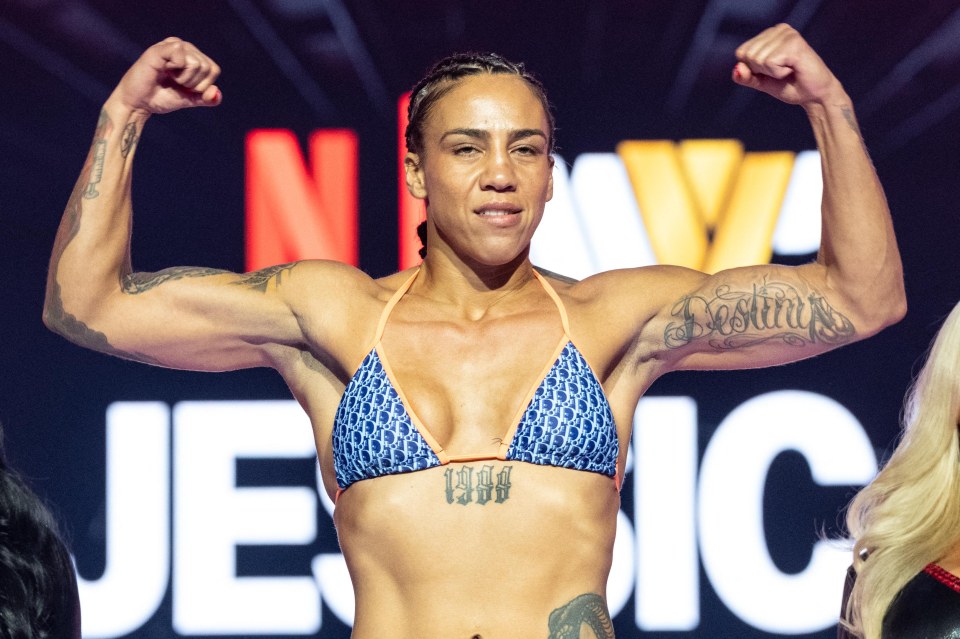 Jessica Camara flexing her biceps at a press event.