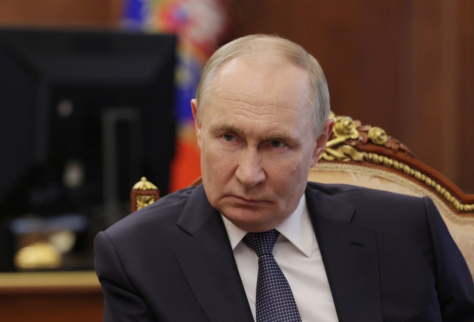 Vladimir Putin in a meeting.