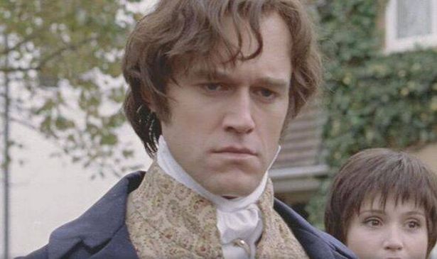 A man in a cravat looks serious