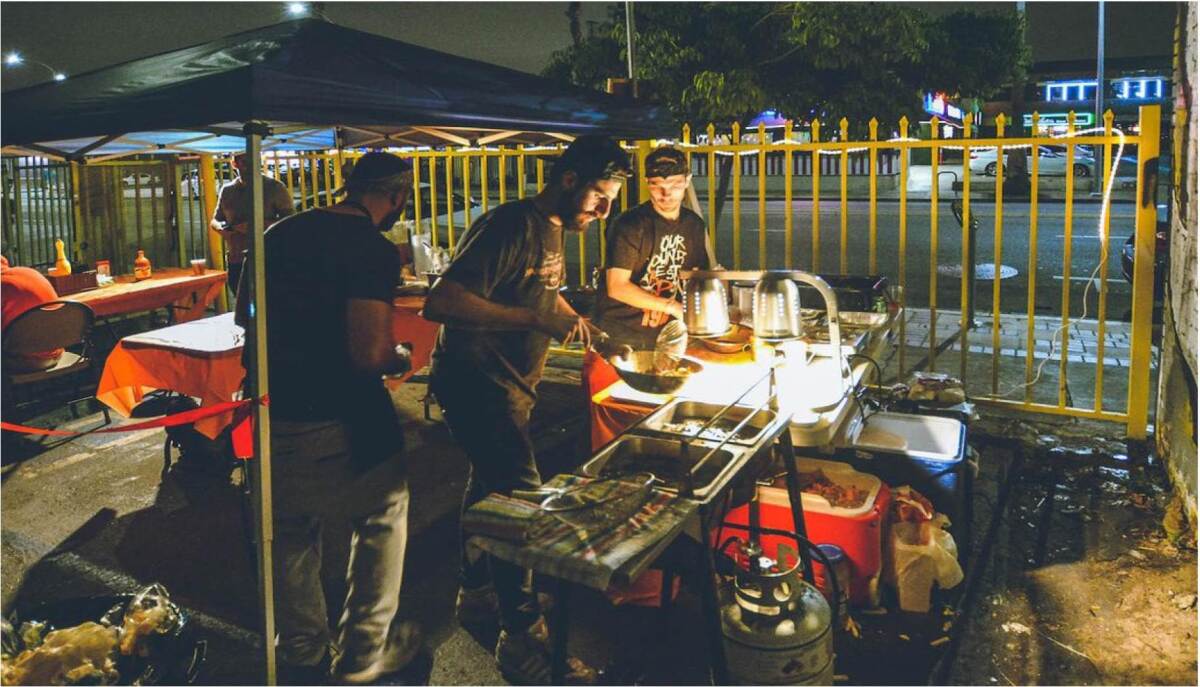 The founders of Dave's Hot Chicken work the line in their East Hollywood parking lot pop-up in 2017.