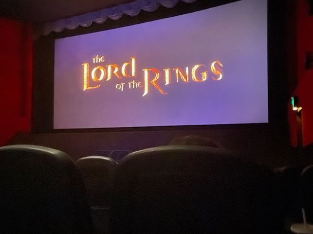 Cinema screen showing the Lord of the Rings logo