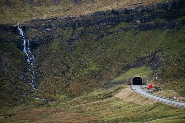 The Vidareidi tunnel is pictured on the Vidoy Island, on October 10, 2021, near Vidareidi village in the Faroe Islands. - The Faroe Islands are known for its fishing and sheep farming as the main industries. (Photo by Jonathan NACKSTRAND / AFP) (Photo by JONATHAN NACKSTRAND/AFP via Getty Images)