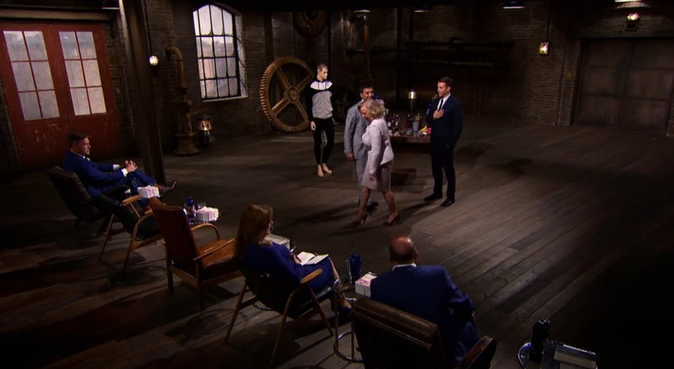 A scene from Dragons' Den showing entrepreneurs pitching to investors.