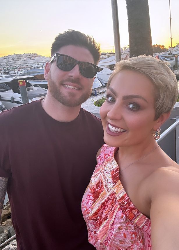 Amy smiles with husband Ben in selfie