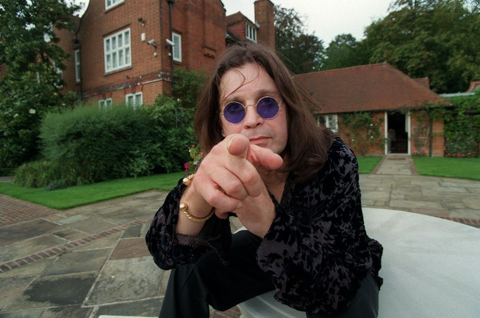 Ozzy Osbourne pointing at the camera.