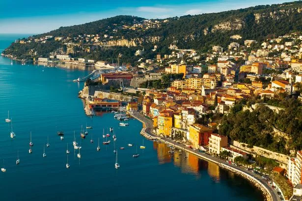 The bay of Villefranche sur Mer with yachts mmorring in front of the city