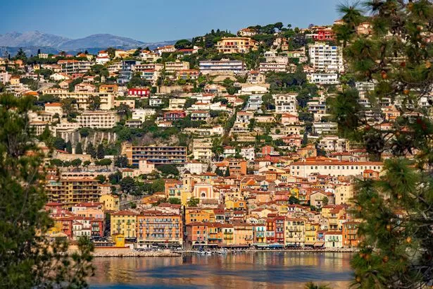 The harborside restaurants and hotels of the town of Villefranche-sur-Mer, France, as seen from Cap Ferrat.