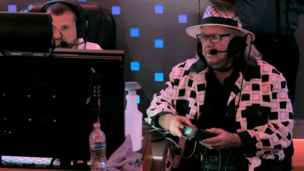 WWE Match Producer Michael Hayes watches on from Gorilla position