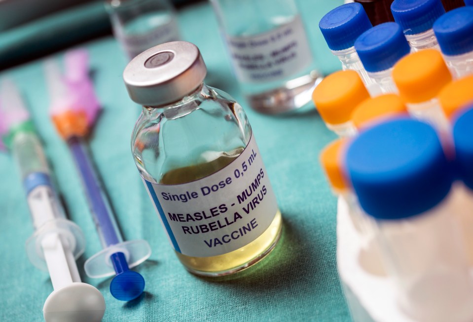 MMR vaccine vial with syringes and test tubes.