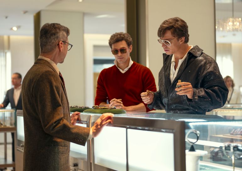 This image released by Netflix shows Cooper Koch as Erik Menendez, center, and Nicholas Chavez as Lyle Menendez, right