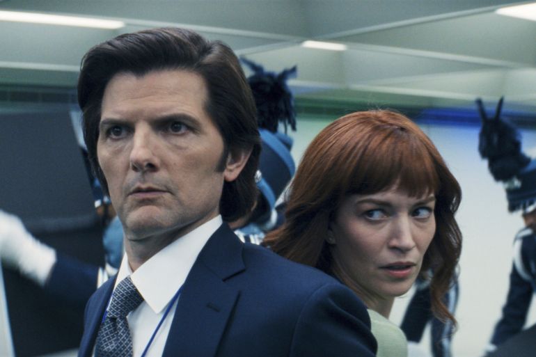 This image released by Apple TV+ shows Adam Scott, left, and Britt Lower in a scene from "Severance." (Apple TV+ via AP)