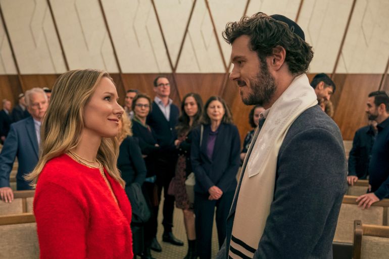 This image released by Netflix shows Kristen Bell, left, and Adam Brody in a scene from "Nobody Wants This."