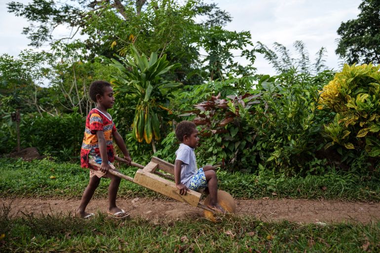 Children play on Pele Island