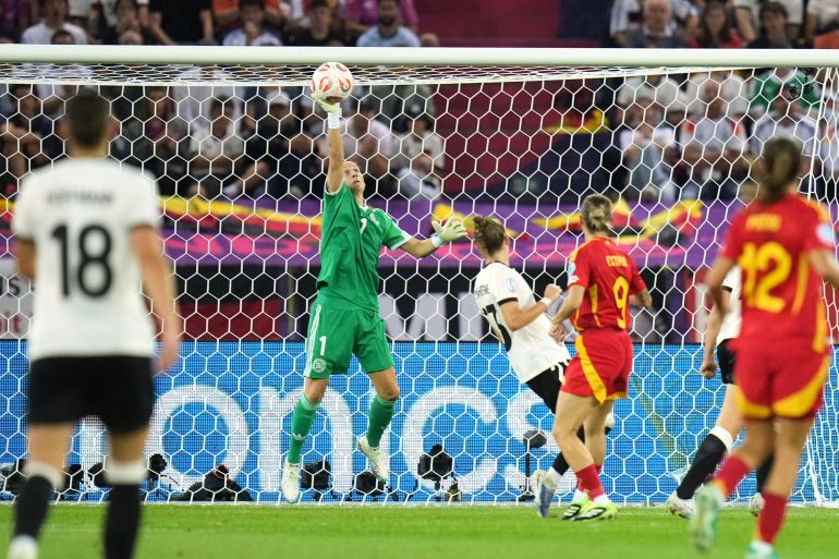 Germany goalkeeper Ann-Katrin Berger saves a shot from Spain's Esther Gonzalez during the Women's Euro 2025 semifinals