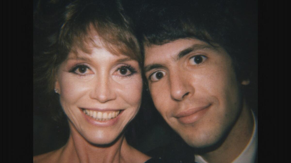 Mary Tyler Moore smiles with her husband