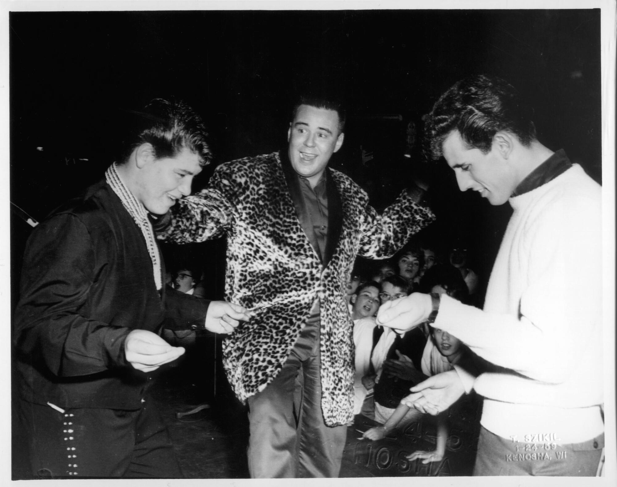 Candid shot of Ritchie Valens, Big Bopper (J.P. Richardson) and Buddy Holly during the Winter Dance Party Tour.
