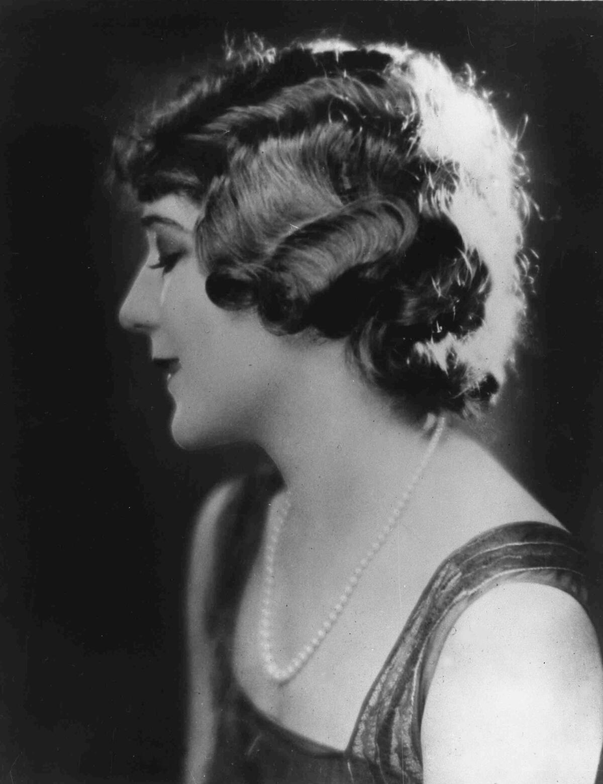 A young woman in profile from in the 1920s.