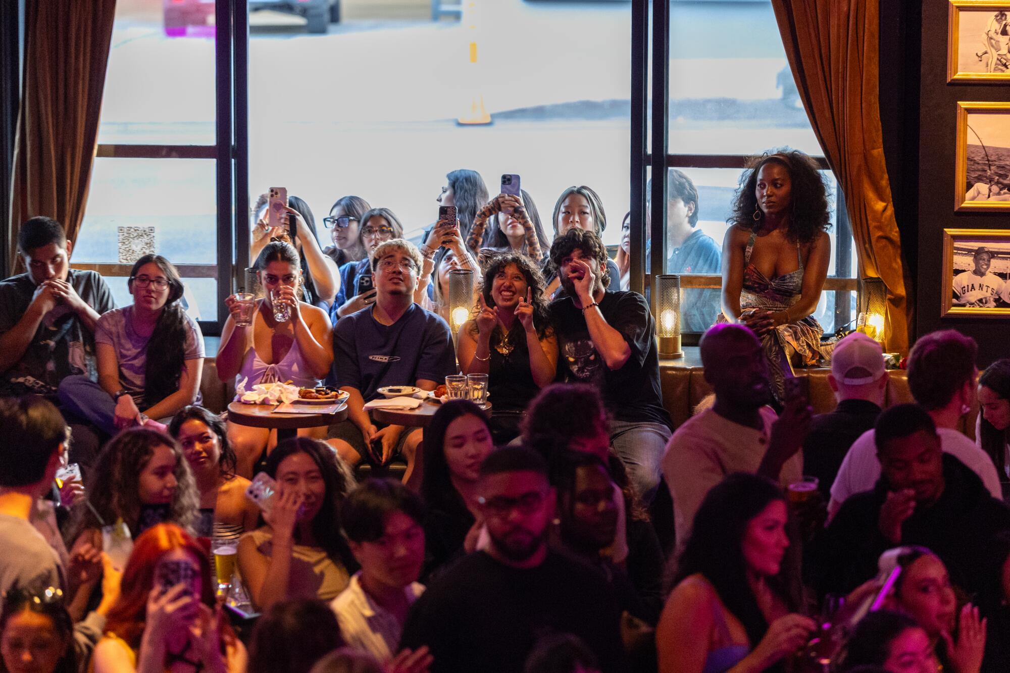 Attendees celebrate the start of the episode.