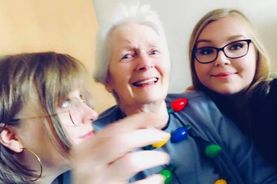 Photo of a grandmother with her two granddaughters.