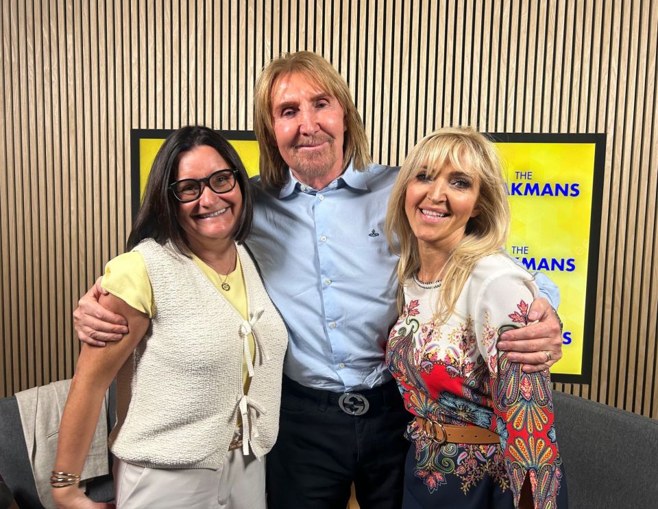 Three people posing for a photo.