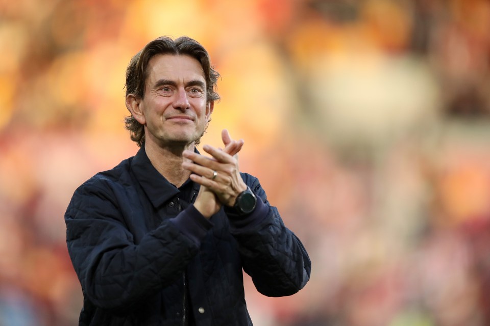 Photo of Thomas Frank clapping.