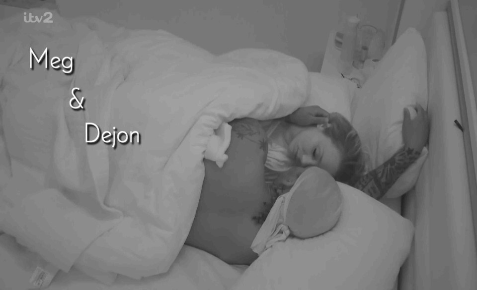 Meg and Dejon cuddling in bed.