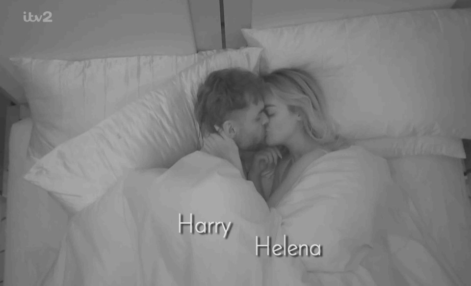 Harry and Helena kissing in bed.