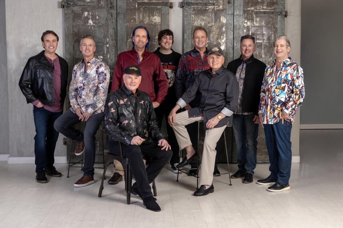 Groupo of older men posing together for a band shot