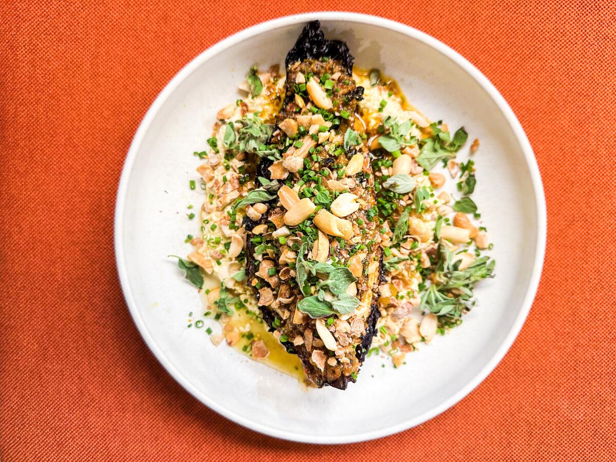 Hispi cabbage with pickled apricots and many other garnishes at Lebanese restaurant Kubri in Paris.