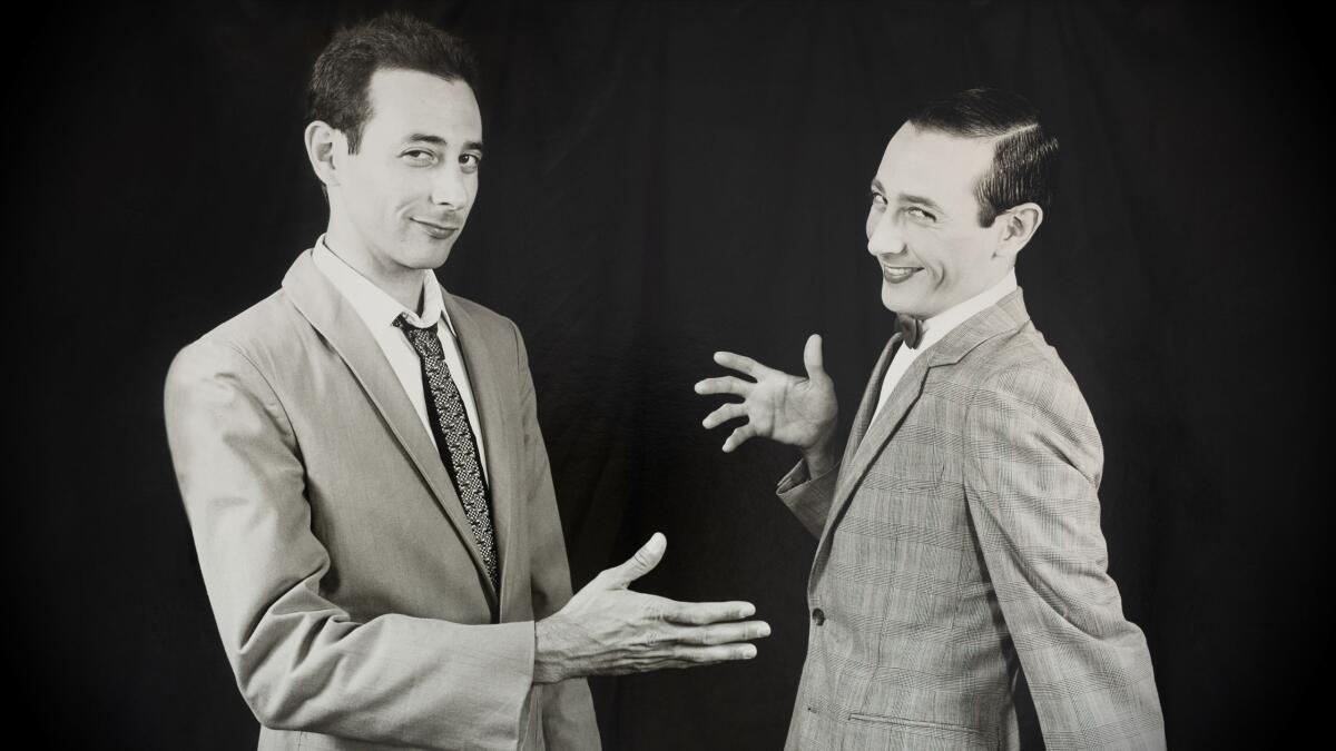 A man in a gray suit, twice over.
