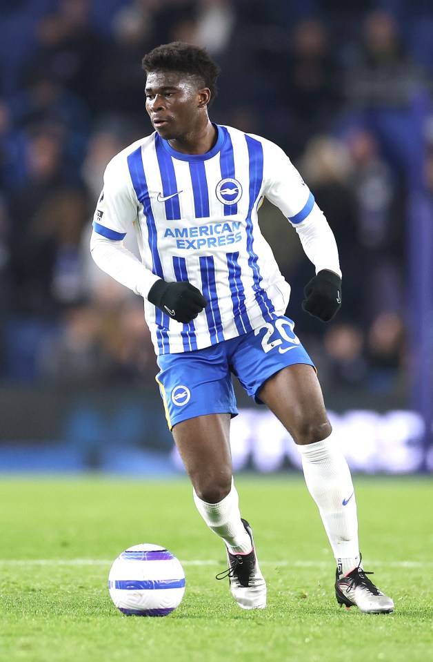 Carlos Baleba of Brighton & Hove Albion controls the ball during a soccer match.
