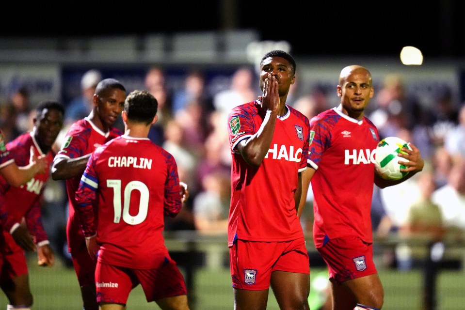 Soccer players celebrating a goal.