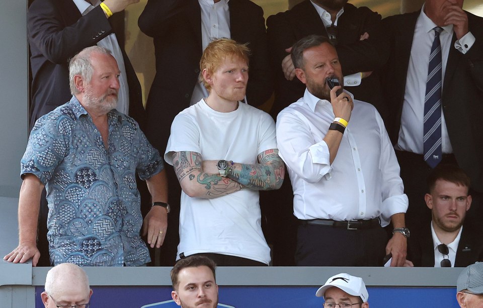 Ed Sheeran watching a Carabao Cup match.