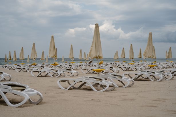 Empty sun loungers laid out on a beach in the Bulgarian Black Sea resort of Albena