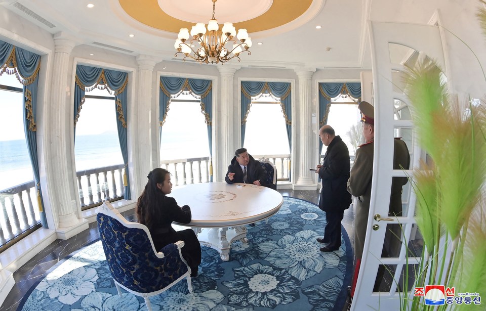 Kim Jong Un and his daughter inspecting a hotel in Wonsan.