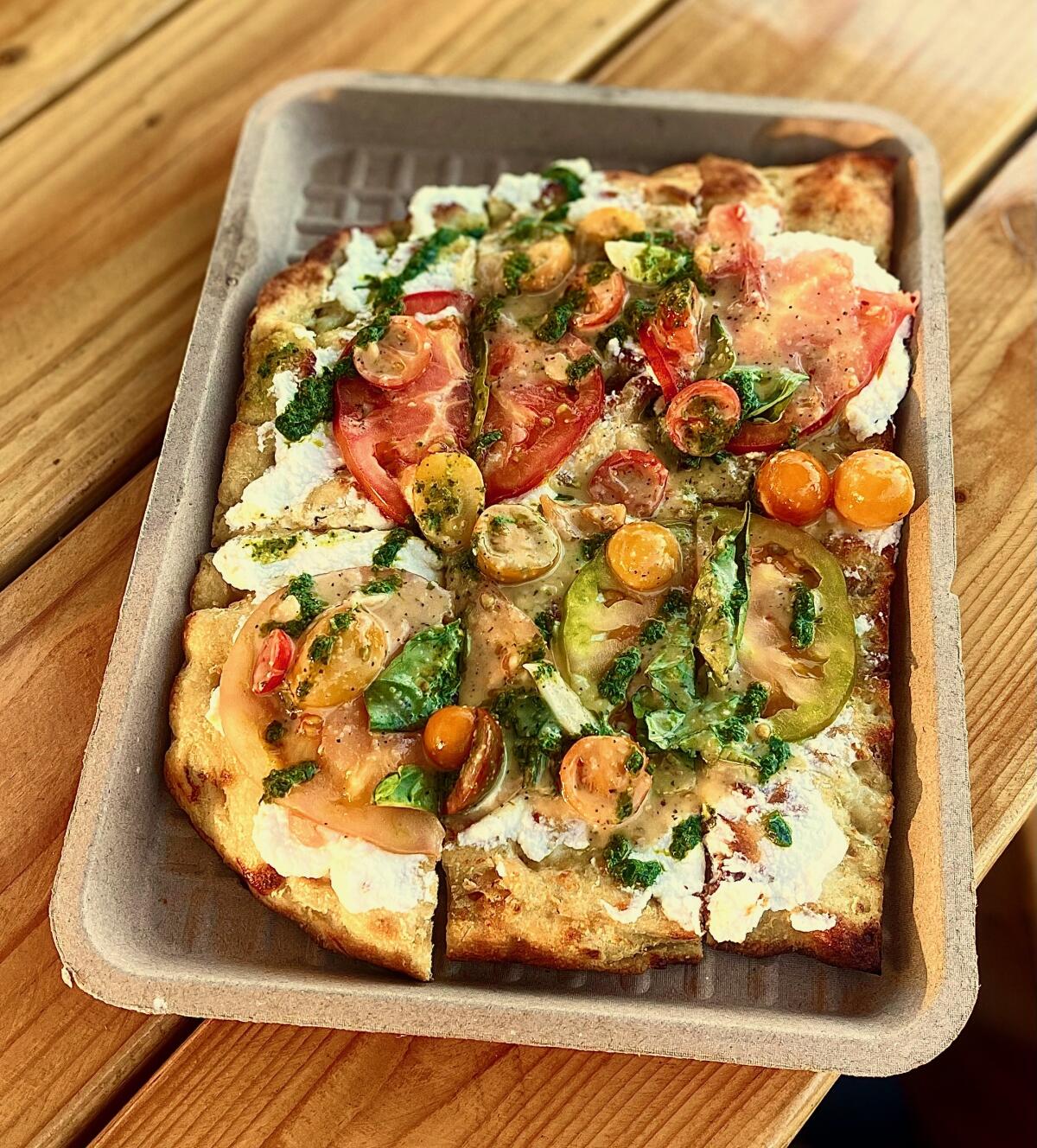 Triple Beam's heirloom tomato pizza served at the pop-up hosted by Good Neighbor Bar and West Altadena Wine + Spirits.