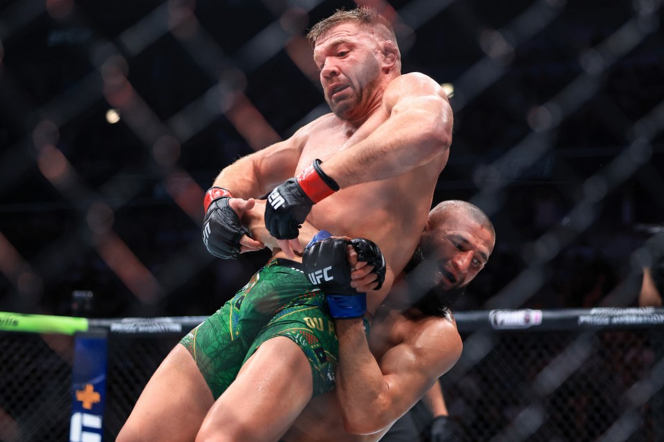 Khamzat Chimaev taking down Dricus du Plessis in a UFC match.
