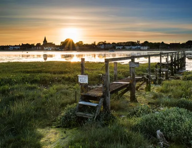 Image of low tide at Bosham Quay as the sun sets