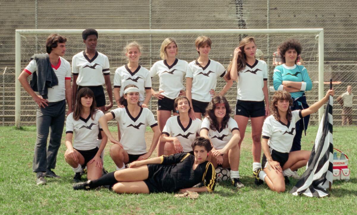 A woman's soccer team poses for a photo.