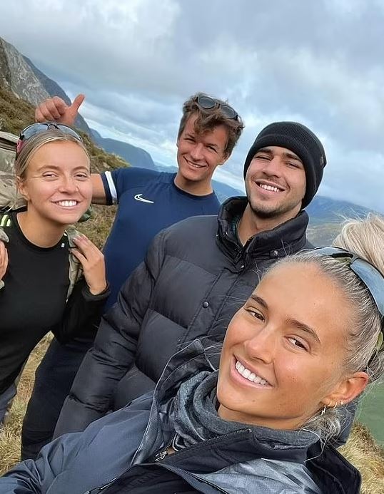 Molly-Mae Hague's sister Zoe with three other people in a mountain landscape.