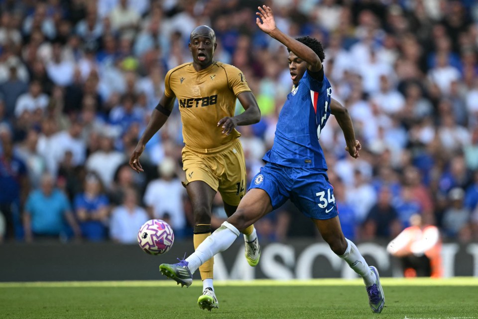 Chelsea's Josh-Kofi Acheampong and Crystal Palace's Jean-Philippe Mateta competing for the ball.