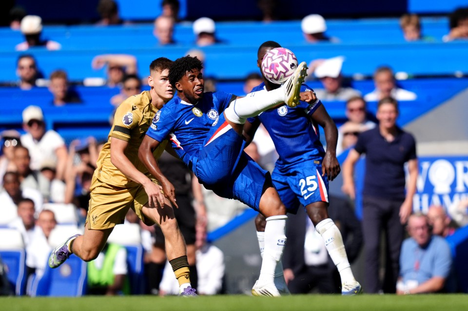 Andrey Santos of Chelsea clears the ball during a Premier League match.