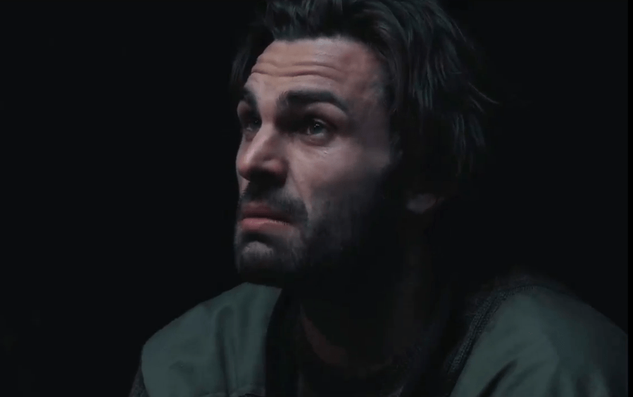 Close-up of a man looking pensive.